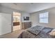 Bedroom with ensuite bathroom, flat screen tv, and large window at 173 Petaluma Valley Dr, Las Vegas, NV 89138