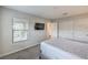 Bright bedroom with a mounted TV, large window, and clean finishes at 173 Petaluma Valley Dr, Las Vegas, NV 89138