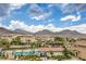 Beautiful view of community pool and homes with mountain backdrop at 173 Petaluma Valley Dr, Las Vegas, NV 89138