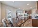 Dining area adjacent to the kitchen and living room with access to an outdoor balcony at 173 Petaluma Valley Dr, Las Vegas, NV 89138