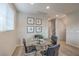 Modern dining area featuring a glass-top table with seating for four and stylish wall decor at 173 Petaluma Valley Dr, Las Vegas, NV 89138