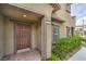 Inviting front entrance featuring a decorative brown door with brick walkway and neatly trimmed landscaping at 173 Petaluma Valley Dr, Las Vegas, NV 89138
