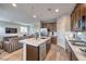 Spacious kitchen island with stainless steel appliances and open living area at 173 Petaluma Valley Dr, Las Vegas, NV 89138