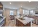 Kitchen island with stainless steel sink, dishwasher, and open layout to living spaces at 173 Petaluma Valley Dr, Las Vegas, NV 89138