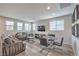 Spacious living room featuring modern furnishings, wood-look floors, and bright natural light at 173 Petaluma Valley Dr, Las Vegas, NV 89138