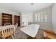 Bonus room featuring carpeted floors, plantation shutters, large bookshelves and tables for activities at 1912 Summer Pine Ct # 102, Las Vegas, NV 89134