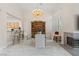 Elegant dining room with marble floors, chandelier, fireplace, bar seating, and large open windows at 1912 Summer Pine Ct # 102, Las Vegas, NV 89134