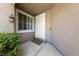 Welcoming front entrance featuring a stylish light fixture, shuttered window, and clean white door at 1912 Summer Pine Ct # 102, Las Vegas, NV 89134