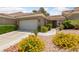 Charming single-story home featuring a well-manicured front yard and a two-car garage at 1912 Summer Pine Ct # 102, Las Vegas, NV 89134