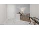Entry hallway featuring marble flooring transitioning to a carpeted hall with a view of the office at 1912 Summer Pine Ct # 102, Las Vegas, NV 89134
