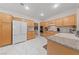 Bright kitchen featuring maple cabinets, granite countertops, and stainless steel appliances at 1912 Summer Pine Ct # 102, Las Vegas, NV 89134