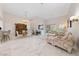 Bright and airy living room featuring elegant marble floors, a fireplace, and ample seating at 1912 Summer Pine Ct # 102, Las Vegas, NV 89134