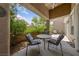 Charming covered patio with comfortable seating, ideal for enjoying the outdoors and a cup of coffee at 1912 Summer Pine Ct # 102, Las Vegas, NV 89134