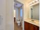 Well-lit bathroom featuring a single sink vanity and ceramic tile flooring at 1995 Sundown Canyon Dr, Henderson, NV 89014