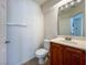 Clean powder room showcasing a wooden vanity and modern fixtures at 1995 Sundown Canyon Dr, Henderson, NV 89014