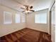 Bedroom with a ceiling fan, large windows, and a closet for easy storage and organization at 1995 Sundown Canyon Dr, Henderson, NV 89014