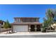 Charming two-story home featuring a two-car garage and desert landscaping at 1995 Sundown Canyon Dr, Henderson, NV 89014