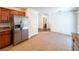 Bright kitchen with stainless steel refrigerator and tile flooring at 1995 Sundown Canyon Dr, Henderson, NV 89014