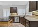 A modern kitchen featuring tile backsplash, stainless steel appliances and lots of light at 2328 Fossil Canyon Dr, Henderson, NV 89052
