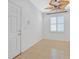 Bright living room with tile flooring and stylish ceiling fan at 2328 Fossil Canyon Dr, Henderson, NV 89052