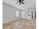 Bright living room featuring tile floors, and a pass through to the kitchen and dining area at 2328 Fossil Canyon Dr, Henderson, NV 89052
