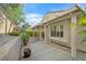 Well landscaped backyard with a covered patio and stone pavers, perfect for outdoor living at 2328 Fossil Canyon Dr, Henderson, NV 89052