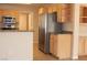 Bright eat-in kitchen with stainless steel appliances and bar seating to a casual dining area at 3001 Anna Bay Dr, Las Vegas, NV 89134