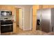 Bright eat-in kitchen with stainless steel appliances and access to another room for ample storage at 3001 Anna Bay Dr, Las Vegas, NV 89134