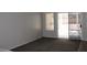 Cozy living room with neutral carpet, large sliding door, and a view of the backyard at 3001 Anna Bay Dr, Las Vegas, NV 89134