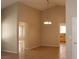 Open-concept living room with tile floors, neutral walls, and a chandelier light fixture at 3001 Anna Bay Dr, Las Vegas, NV 89134
