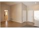 Spacious living room featuring tile flooring, neutral walls, and access to other rooms at 3001 Anna Bay Dr, Las Vegas, NV 89134