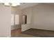 Bright, airy living room with neutral walls and a mix of tile and carpeted floors at 3001 Anna Bay Dr, Las Vegas, NV 89134