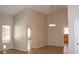 Bright, neutral living room with tile floors and ample natural light from the windows at 3001 Anna Bay Dr, Las Vegas, NV 89134