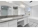 Bathroom featuring dual sinks, gray granite countertops, and white cabinetry at 3217 Harbor Vista St, Las Vegas, NV 89117