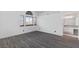 Large bedroom with gray floors, arched windows, and an en suite bathroom at 3217 Harbor Vista St, Las Vegas, NV 89117