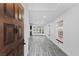 Bright entryway with gray wood floors that lead into a spacious living area at 3217 Harbor Vista St, Las Vegas, NV 89117