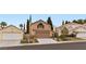 Charming home with front yard landscaping, two car garage, and neutral color palette at 3217 Harbor Vista St, Las Vegas, NV 89117