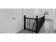 Hallway with gray wood-look floors, white walls, white doors and black trim at 3217 Harbor Vista St, Las Vegas, NV 89117