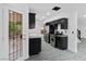 Kitchen with stainless steel appliances, granite countertops, and dark cabinets at 3217 Harbor Vista St, Las Vegas, NV 89117