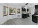 Kitchen with dark cabinets, stainless steel appliances, granite countertops, and pool view at 3217 Harbor Vista St, Las Vegas, NV 89117
