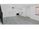 Living room with wood-look flooring, neutral walls, and lots of natural light at 3217 Harbor Vista St, Las Vegas, NV 89117