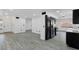 Open floor plan featuring updated kitchen, stainless appliances and spacious living area at 3217 Harbor Vista St, Las Vegas, NV 89117