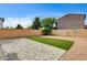 Backyard featuring low maintenance landscaping with brick fence, artificial turf, and gravel at 3760 Paseo De Paz Ave, Las Vegas, NV 89115