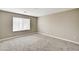Bright bedroom with a large window and neutral walls, ready for personalization at 3760 Paseo De Paz Ave, Las Vegas, NV 89115