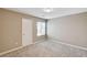 This cozy bedroom has neutral walls, carpet, and a bright window at 3760 Paseo De Paz Ave, Las Vegas, NV 89115