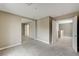 Large bedroom with plush carpet, open doorway and closet space at 3760 Paseo De Paz Ave, Las Vegas, NV 89115