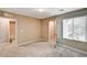 This neutral bedroom has carpet with an open doorway leading to the bathroom at 3760 Paseo De Paz Ave, Las Vegas, NV 89115