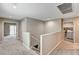 Upstairs hallway with plush carpeting, staircase and laundry room at 3760 Paseo De Paz Ave, Las Vegas, NV 89115