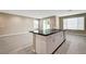 Kitchen area featuring island with a sink, a dishwasher and white kitchen cabinets at 3760 Paseo De Paz Ave, Las Vegas, NV 89115