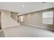 Spacious living room with modern staircase and plenty of natural light from large windows at 3760 Paseo De Paz Ave, Las Vegas, NV 89115